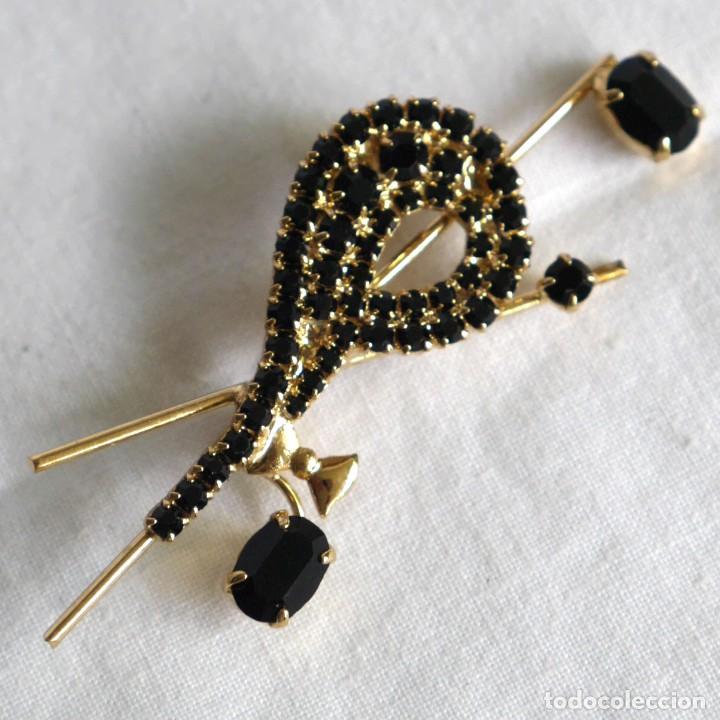 Gioielleria: Broche de pedreria negra y metal dorado