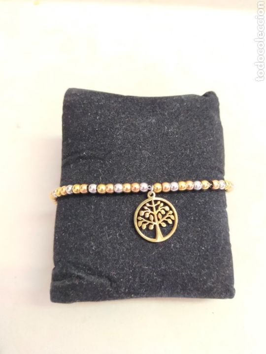 Joyeria: PULSERA DE EMETAL DORADO Y PLATEADO, CON DIJE DEL ARBOL DE LA VIDA.
