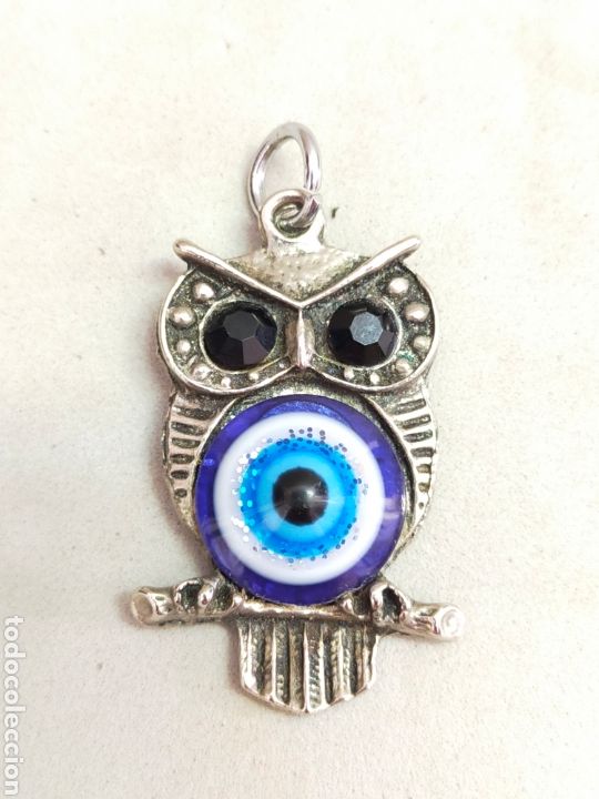 Joaillerie: COLGANTE DENBUHO CON OJO TURCO. SIMBOLO DE LA BUENA SUERTE Y SABIDURIA. 5X2,5 CM.
