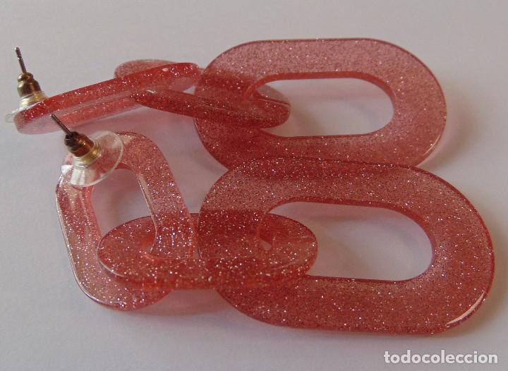 Joyeria: PENDIENTES LARGOS DE BIJOUTER&Iacute;A - PL&Aacute;STICO ROSA TRANSL&Uacute;CIDO CON BRILLO - Foto 1