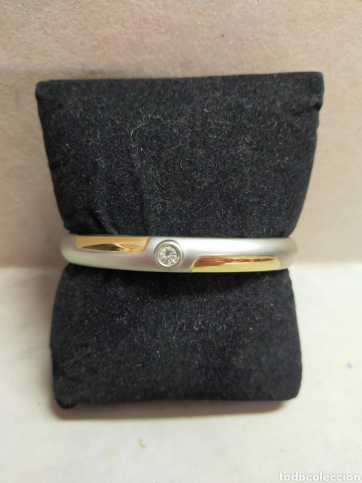 Schmuck: PULSERA RIGIDA DE METAL CON DETALLES DORADOS Y CIRCONITAS CENTRAL.