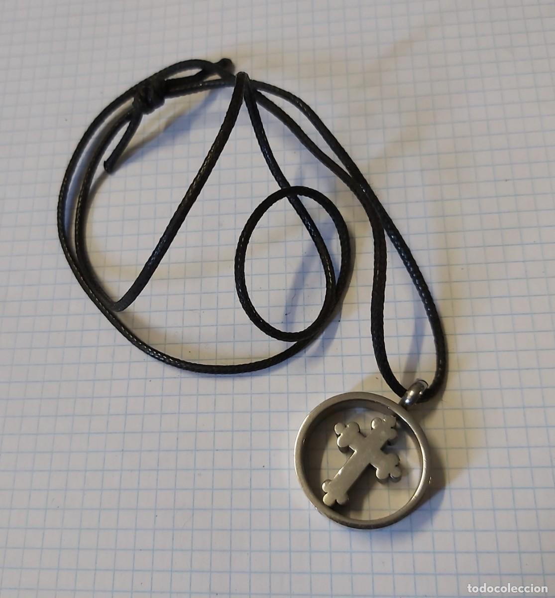 Gioielleria: Colgante con cruz giratoria