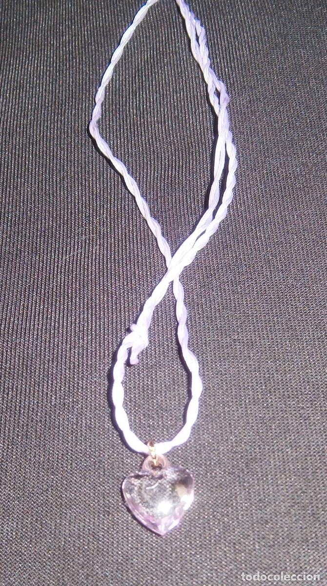 Joaillerie: colgante forma corazon de cristal rosado cordon regulable