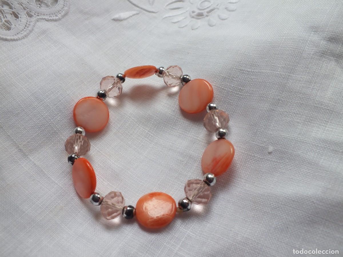 Joaillerie: PULSERA BISUTERIA CON TONOS SALM&Oacute;N NACARADOS