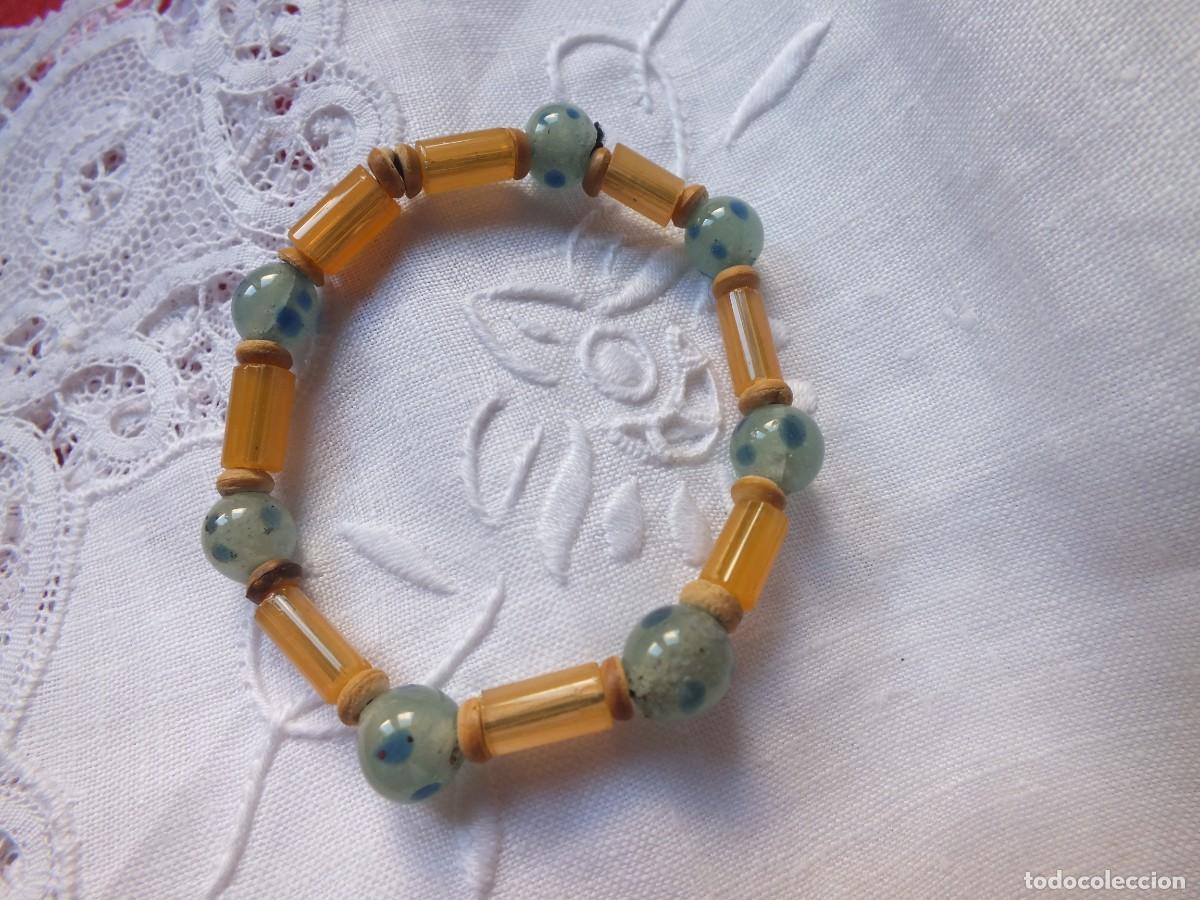 Joaillerie: PULSERA CON BOLITAS DE VIDRIO MADERA