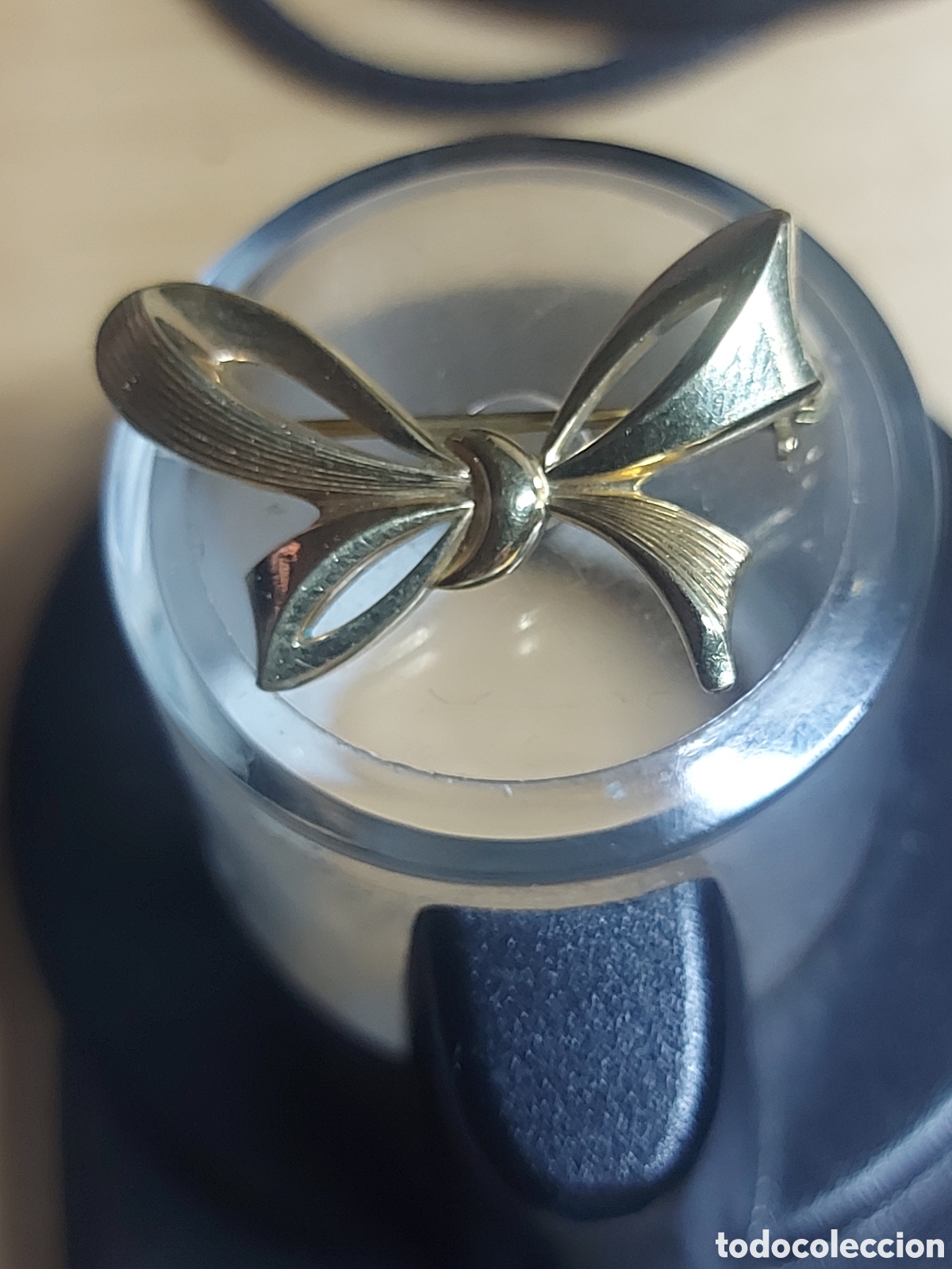 Joyeria: BROQUE EN FORMA DE LAZO EN DORADO - Foto 1