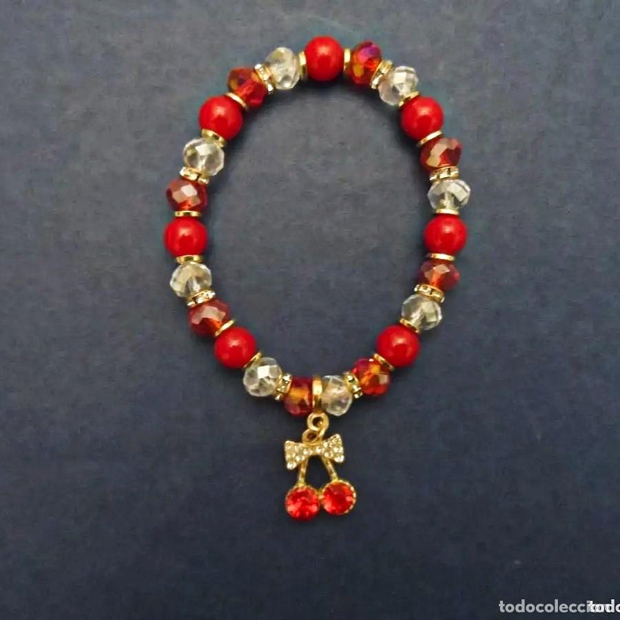 Joyeria: PULSERA ELASTICA PIEDRAS SWAROSKI BOLAS ROJAS CON DIJET CEREZAS Y ALPACA DORADA