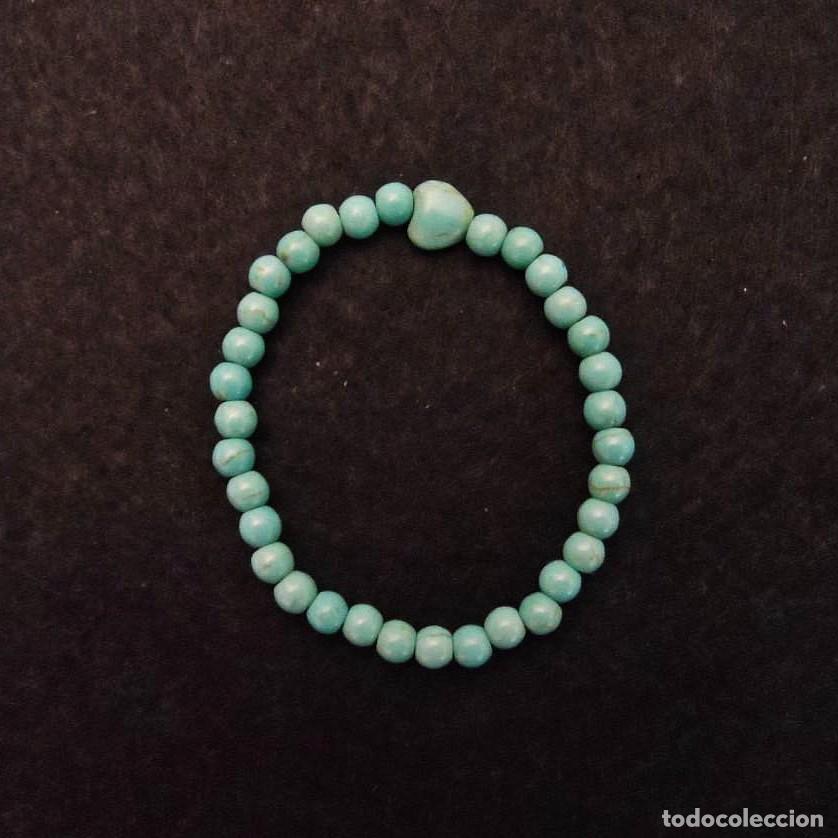 Joaillerie: PULSERA ELASTICA DE BOLAS DE TURQUESA 6 MM CON DIGET CORAZON