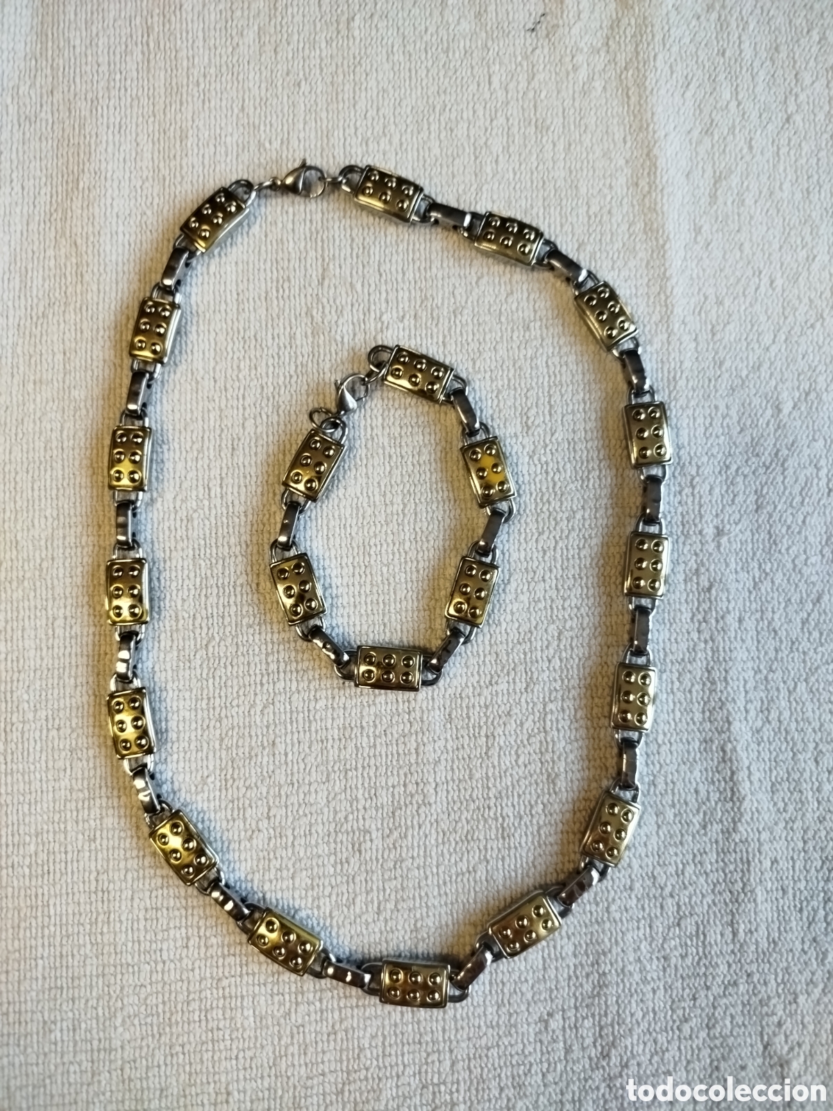 Gioielleria: Collar met&aacute;lico unisex de 52 cms y pulsera a juego de 20 cms.