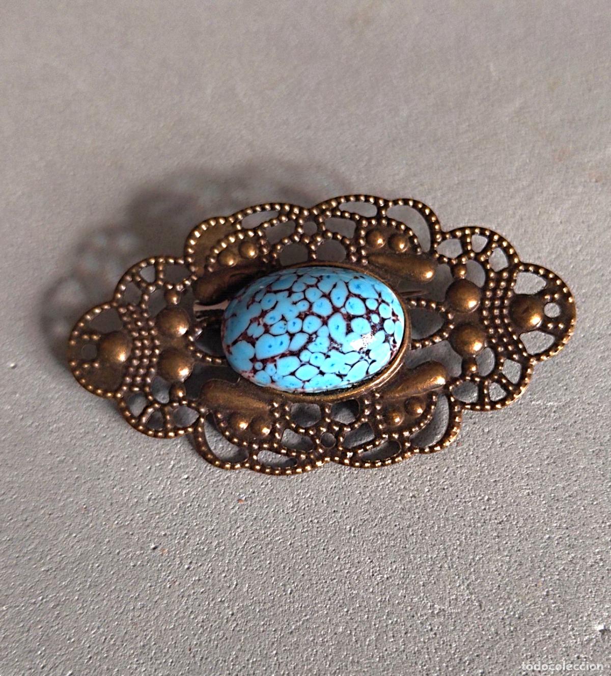 Joyeria: Bonito broche con piedra azul.