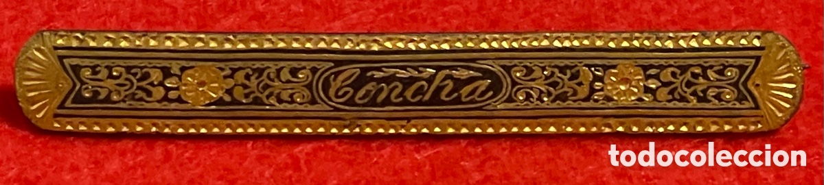 Joyeria: Antiguo broche en oro damasquinado de Toledo.