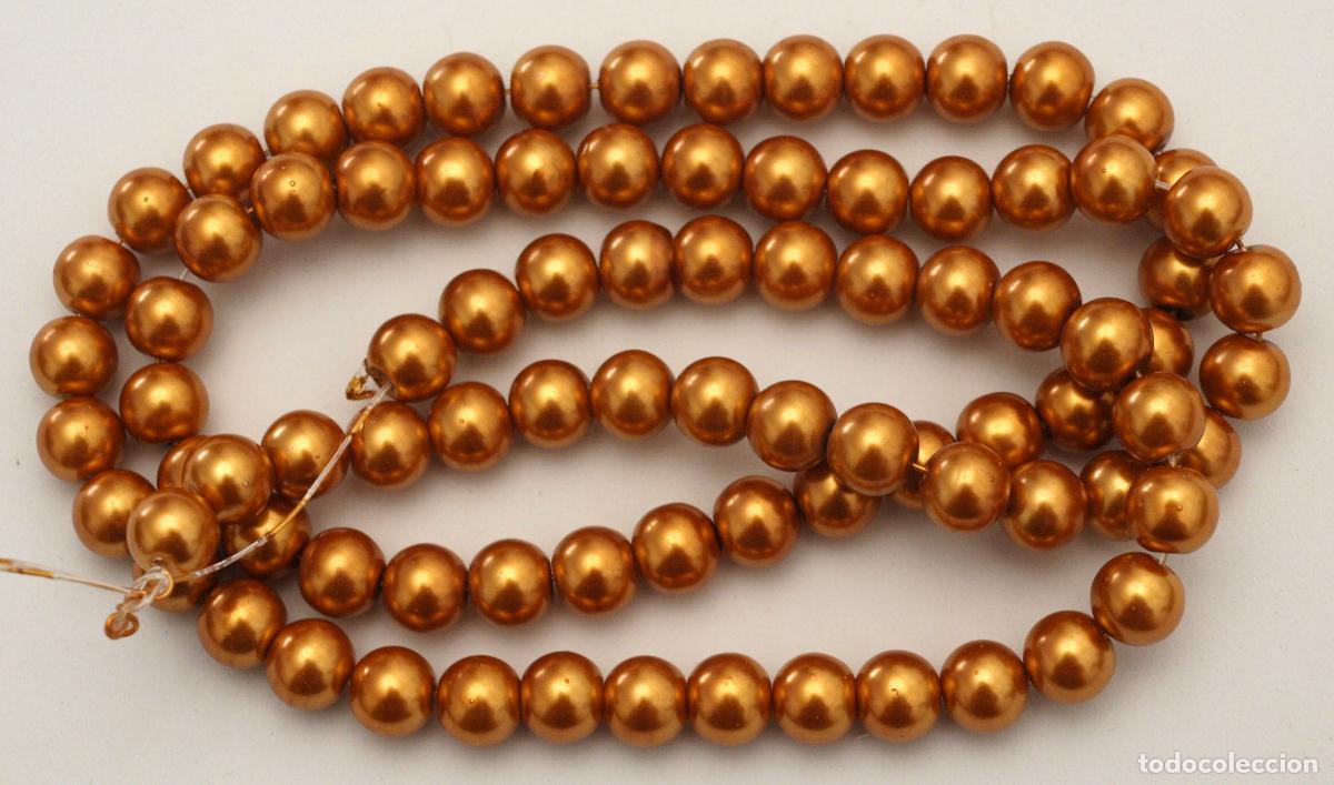 Joyeria: TIRA DE PERLAS DE CRISTAL COLOR DORADO OSCURO. 80 CM LARGO APROX. 9-10 MM DIAMETRO PERLAS. VER FOTOS