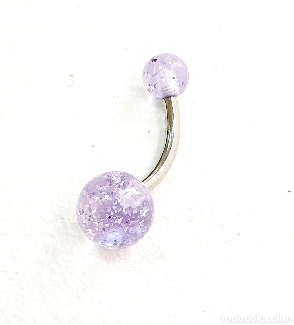 Joyeria: Piercing para ombligo de acero y color morado suave, nuevo