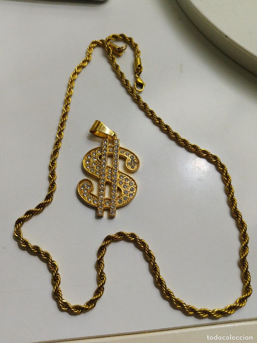 Joyeria: Cadena y colgante s&iacute;mbolo del dinero con circonitas y acabado dorado brillante