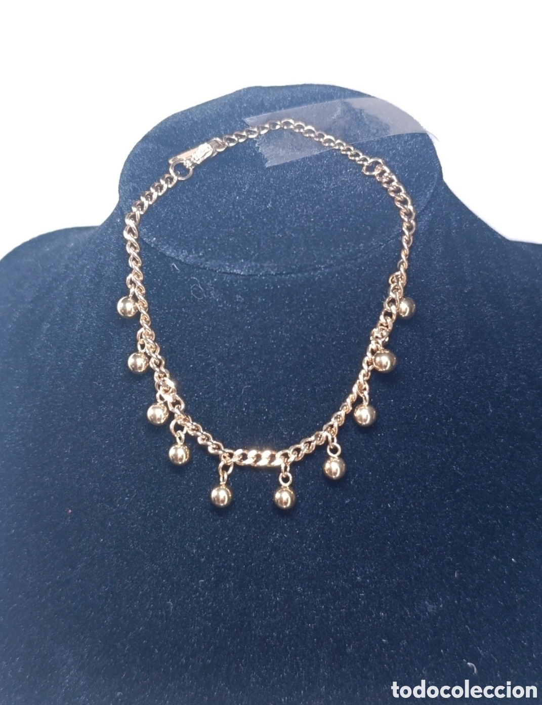 Joyeria: Pulsera acero dorado con bolitas 11 cms