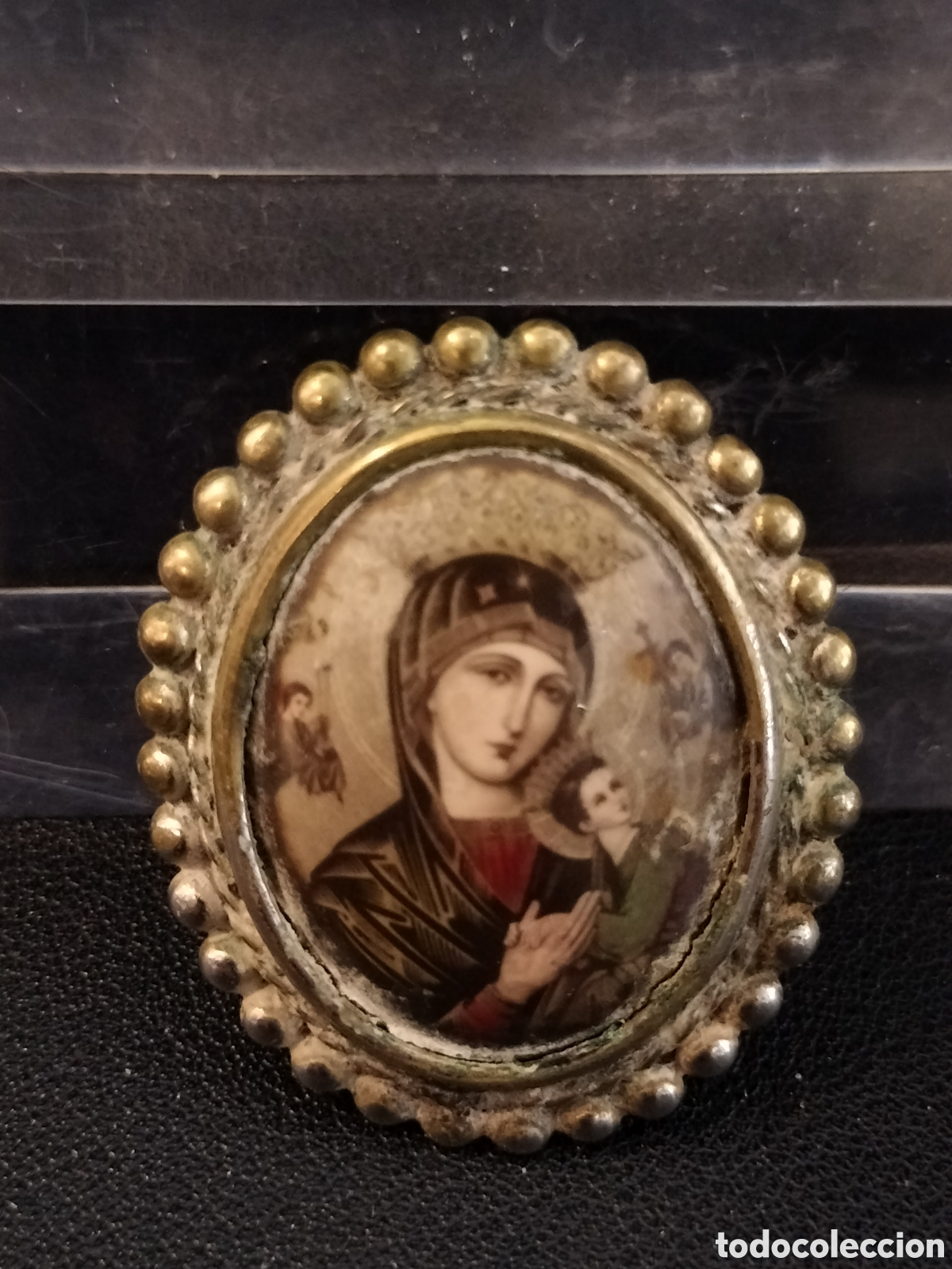 Joyeria: Broche con l&aacute;mina del Perpetuo Socorro.
