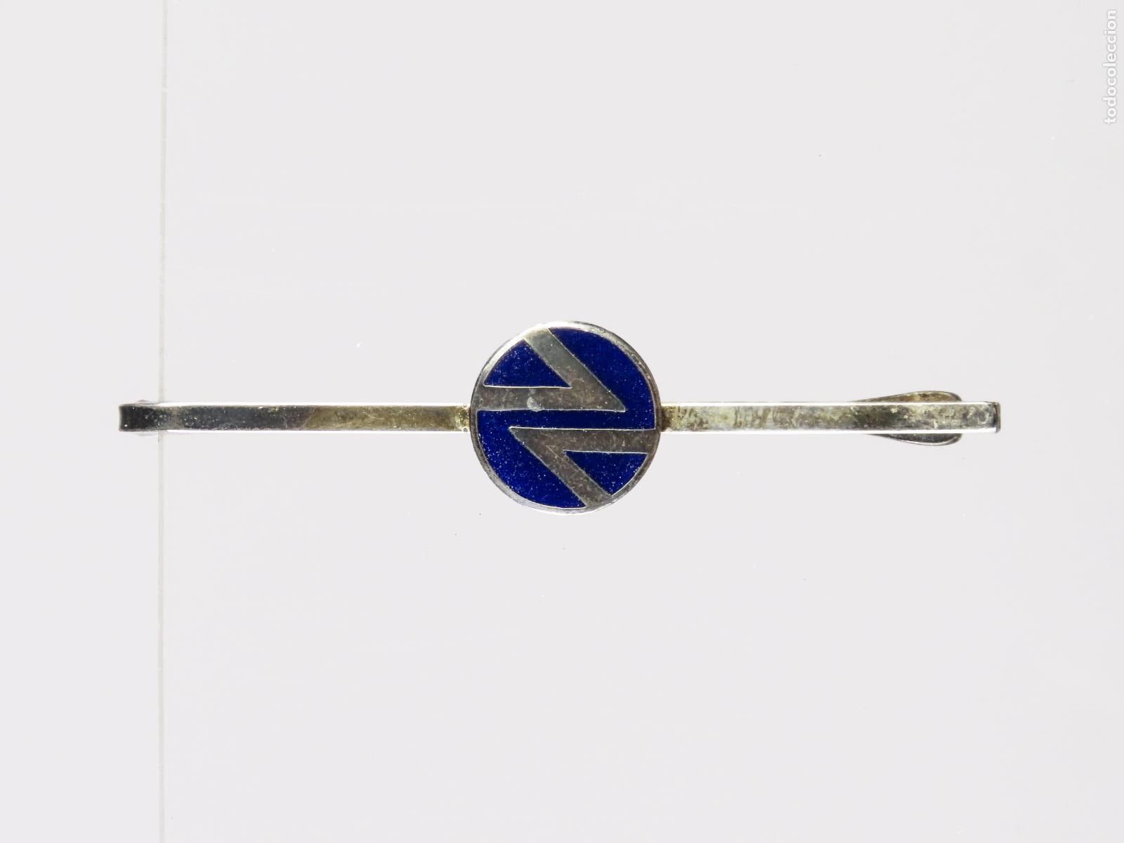 Joyeria: Pisacorbatas RENFE anagrama metal plateado segunda mitad S XX