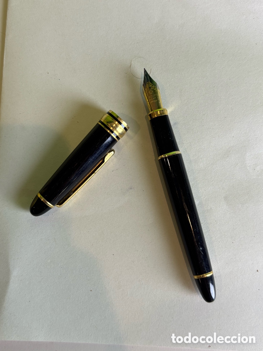 Bol&iacute;grafos antiguos: Pluma estilogr&aacute;fica lacada en negro con detalles dorados y plum&iacute;n Iridium Point Germany