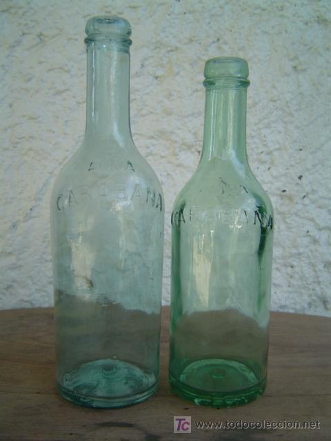 Botellas antiguas: 2 BOTELLAS CARABA&Ntilde;A LETRAS EN RELIEVE - Foto 1
