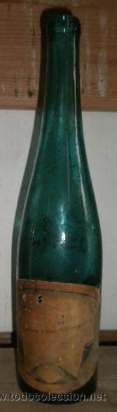 Botellas antiguas: Botella, con restos de etiqueta - Foto 1