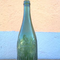 Botellas antiguas: BOTELLA DE CERVEZA EL AGUILA, EN RELIEVE, 75 CL.