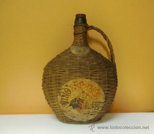 Botellas antiguas: Botella ovalada forrada de mimbre, de Moscatell - Foto 1