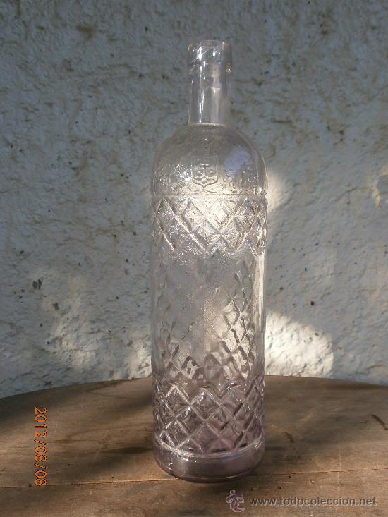 Botellas antiguas: BOTELLA ANIS CARMELITA&Ntilde;O LETRAS EN RELIEVE - Foto 1