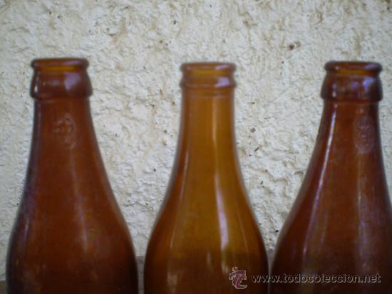 Botellas antiguas: 3 BOTELLAS CERVEZA EL AGUILA - Foto 2