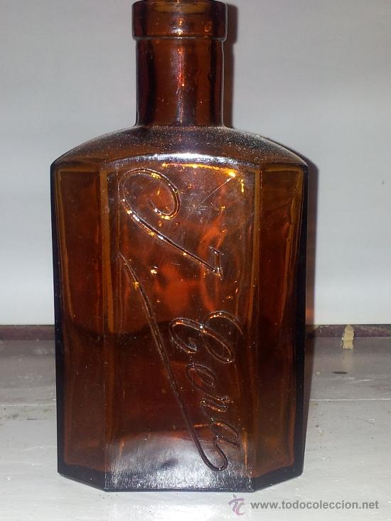 Botellas antiguas: botella con inscripscion en relieve - Foto 1