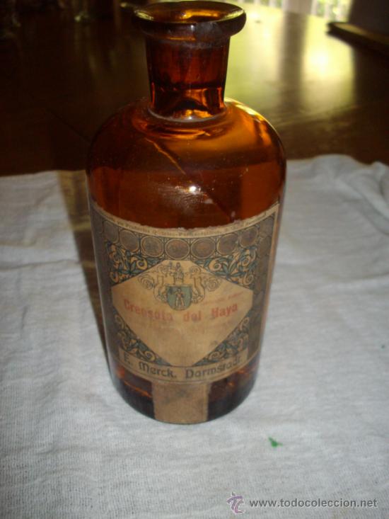 Botellas antiguas: antigua botella de cristal de creososta del haya