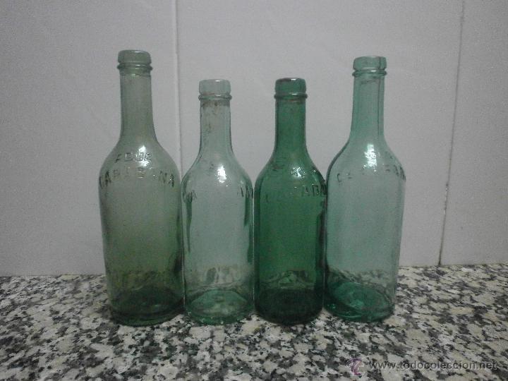 Botellas antiguas: 4 BOTELLA CARABA&Ntilde;A LETRAS EN RELIEVE - Foto 1