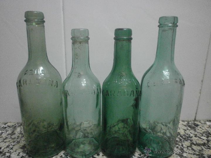 Botellas antiguas: 4 BOTELLA CARABA&Ntilde;A LETRAS EN RELIEVE - Foto 2