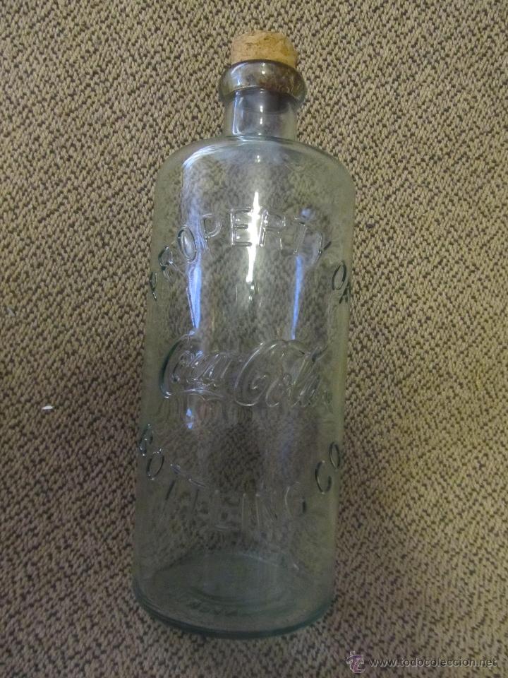Botellas antiguas: M69 BOTELLA RUSTICA DE COCA COLA TRANSPARENTE CON CORCHO ORIGINAL - Foto 1