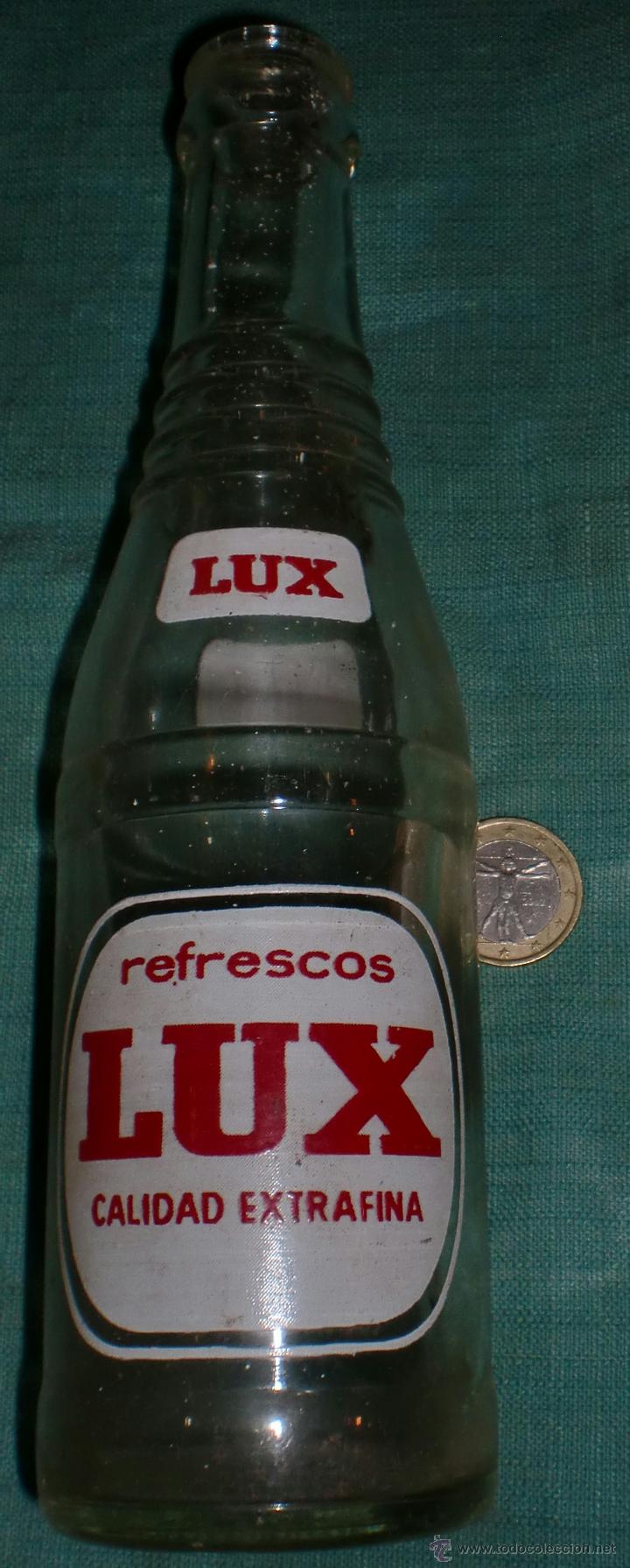 Botellas antiguas: Botella de lux serigrafiada - Foto 1