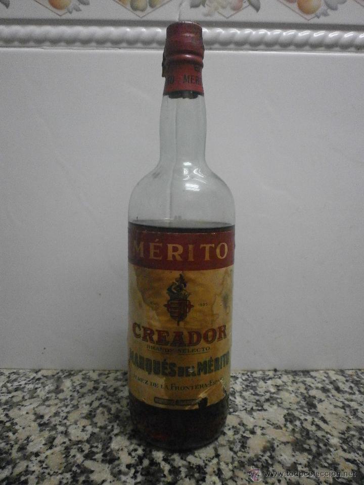 Botellas antiguas: BOTELLA BRANDY CREADOR BODEGAS MARQUE DEL MERITO - Foto 1