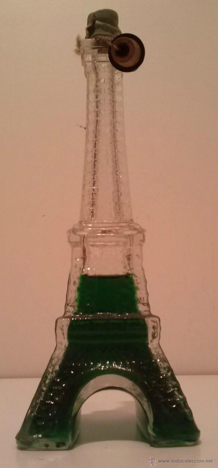 Botellas antiguas: PRECIOSA BOTELLITA DE AVON - FORMA DE LA TORRE EIFFEL - Foto 1