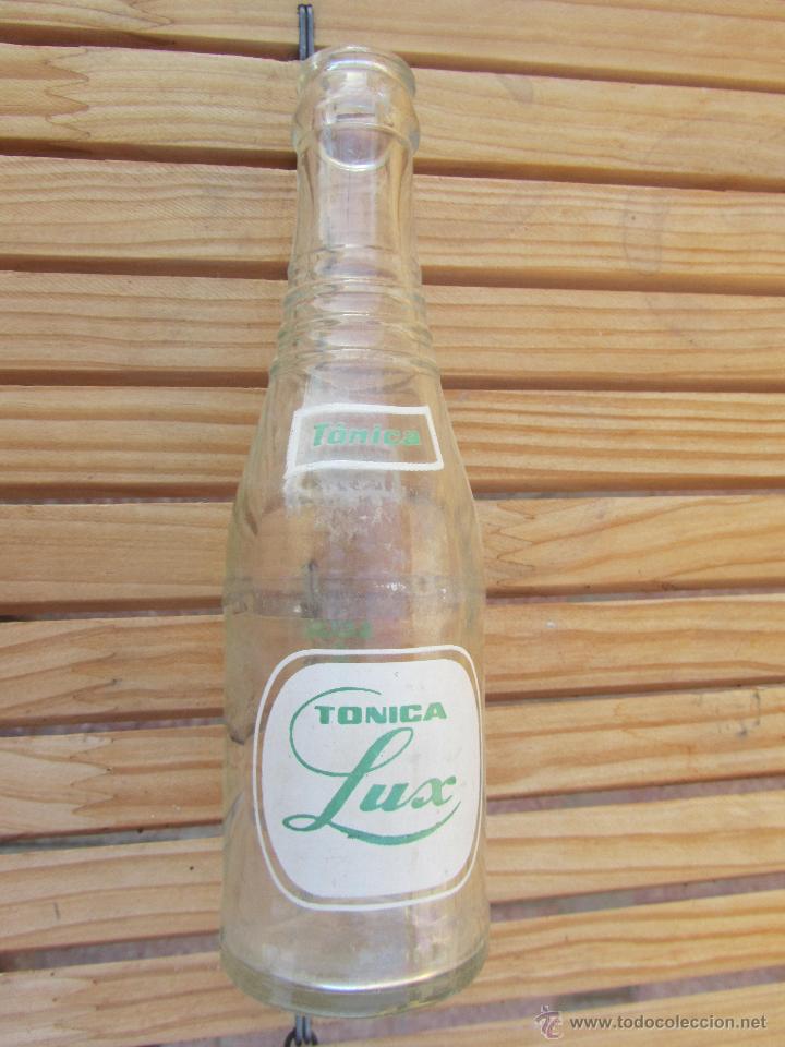 Botellas antiguas: BOTELLIN TONOCA LUX - Foto 1