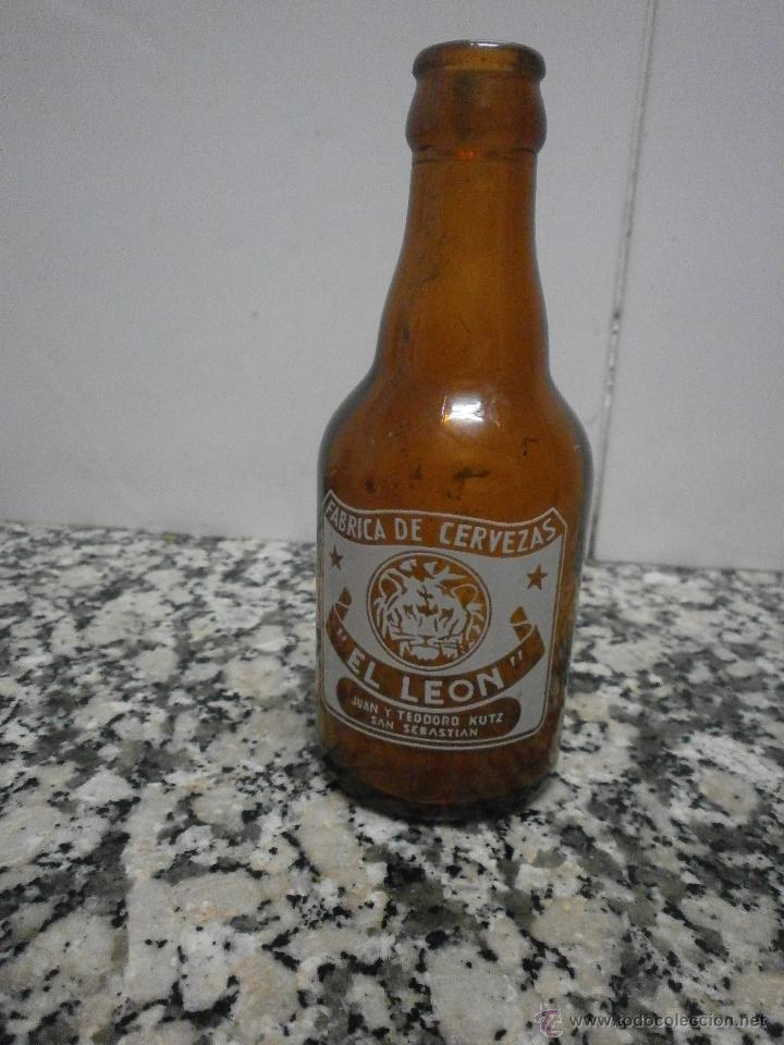 Botellas antiguas: BOTELLIN QUINTO EL  LEON SERIGRAFIADO - Foto 1