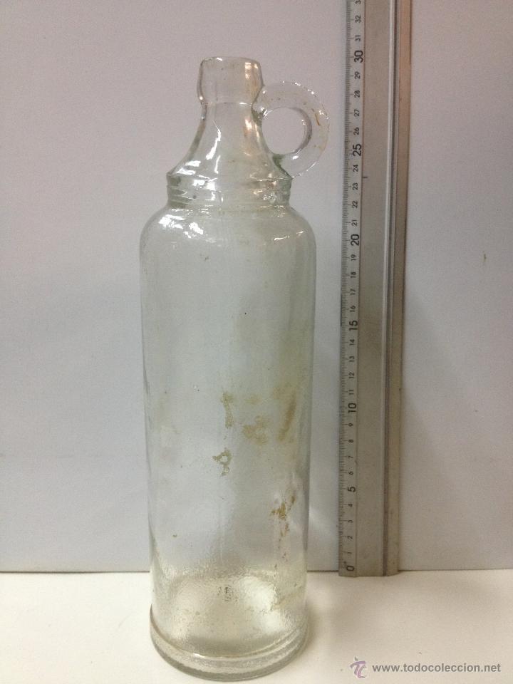 Botellas antiguas: BOTELLA CON ASA - Foto 1