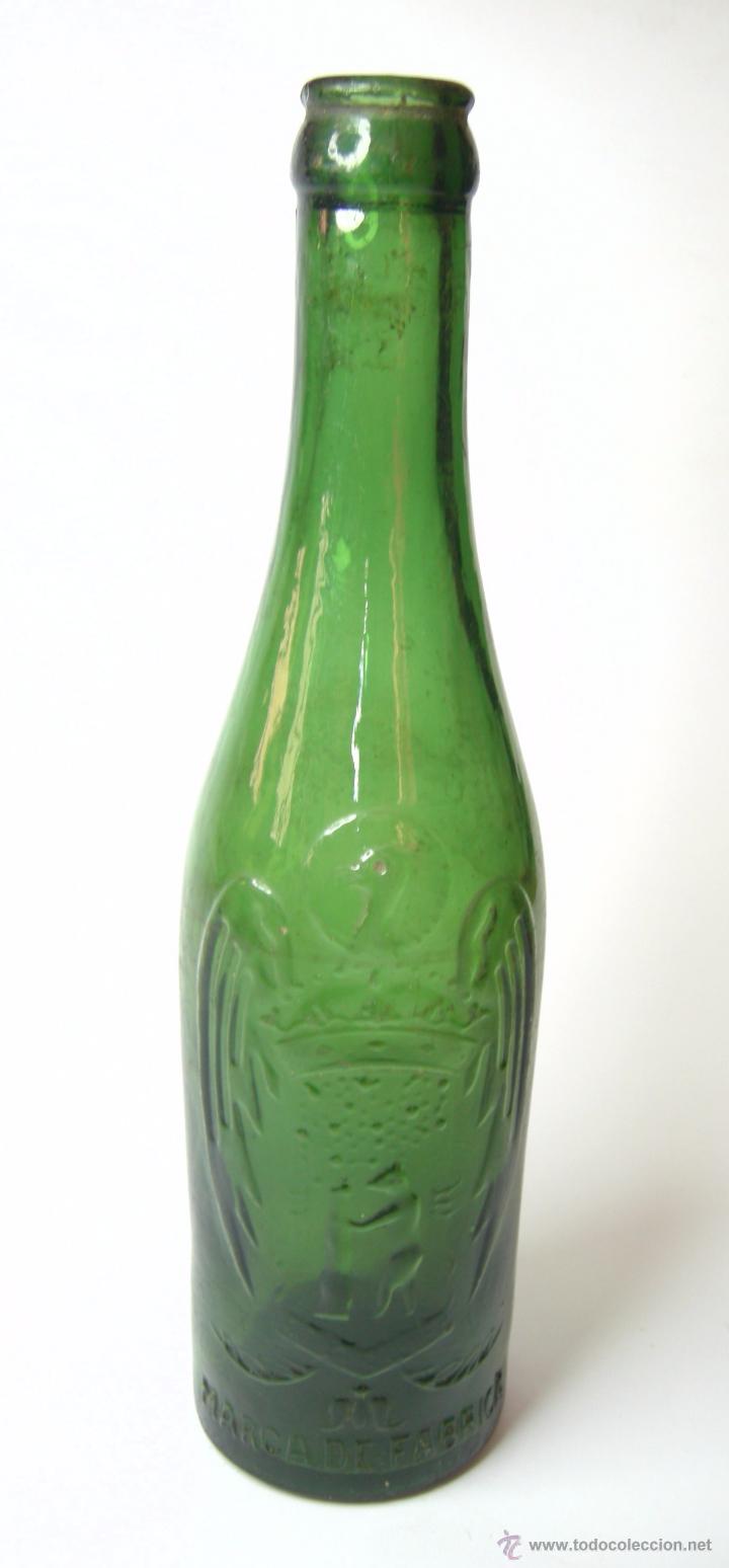 Botellas antiguas: BOTELLA E CERVEZA EL AGUILA - Foto 1