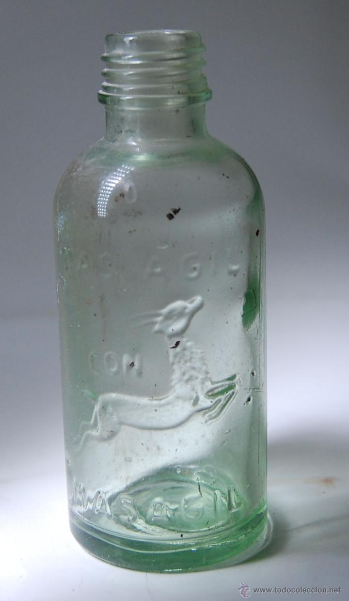 Botellas antiguas: FRASCO O BOTELLA DE MASAJIN EN RELIEVE - Foto 1