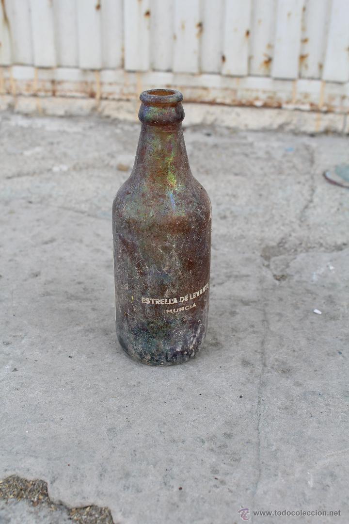 Botellas antiguas: BOTELLA TERCIO ESTRELLA DE LEVANTE - Foto 2