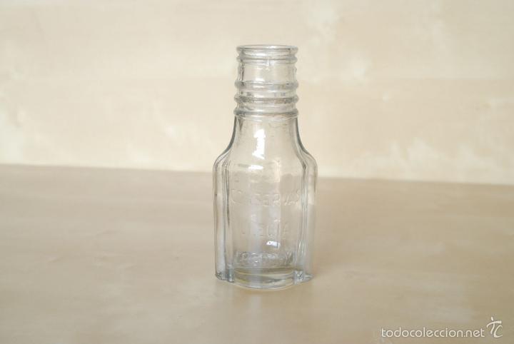 Botellas antiguas: Botella de cristal de conservas Ulecia. logro&ntilde;o - Foto 1