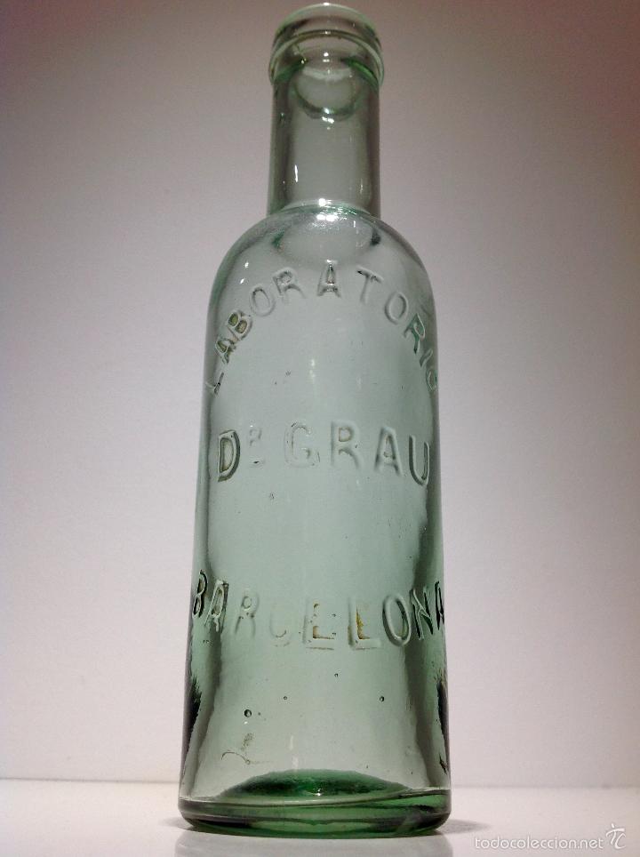 Botellas antiguas: IGUA BOTELLA LABORATORIOS DR. GRAU BARCELONA - Foto 1