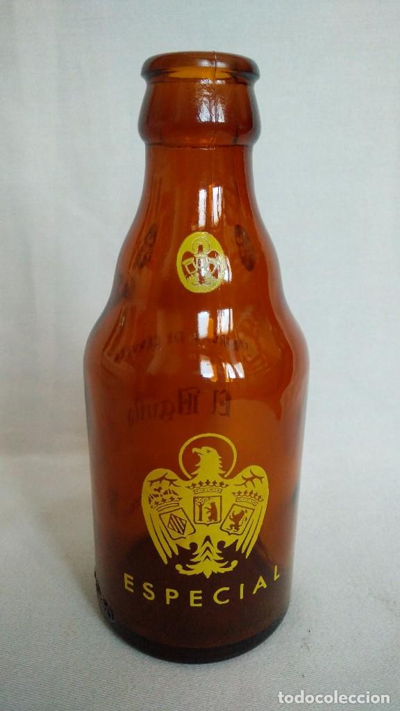 Botellas antiguas: BOTELLA DE CERVEZA EL AGUILA 33 cc. - Foto 1