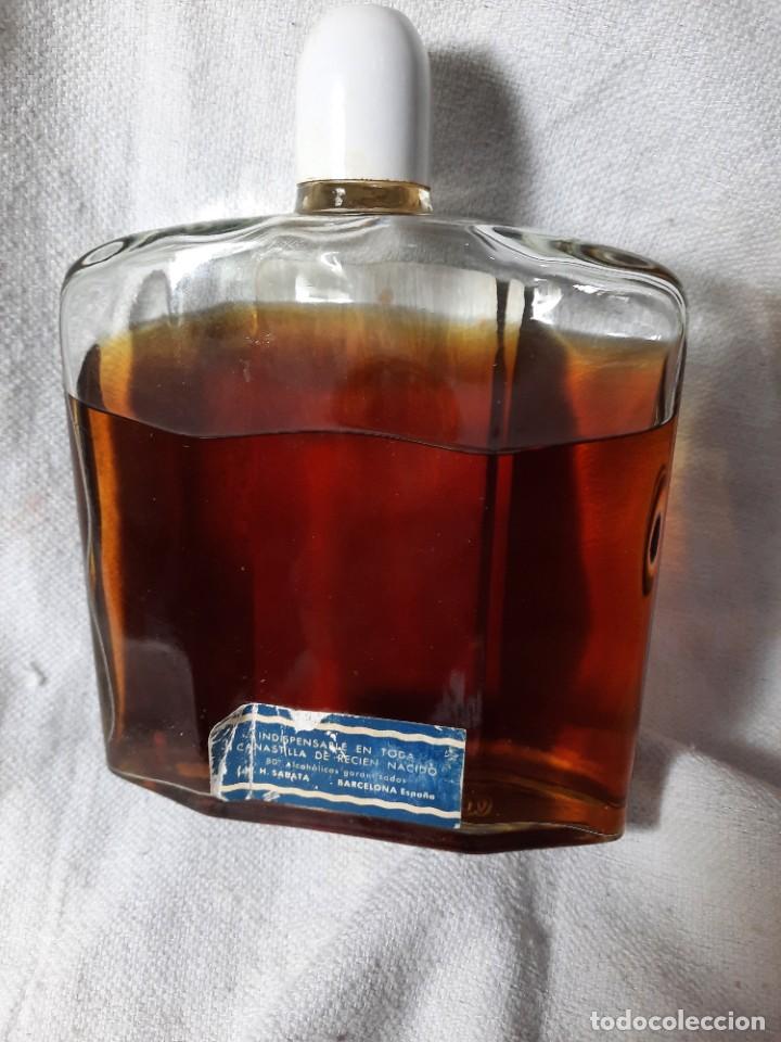 Botellas antiguas: Antigua botella grande NENUCO - Foto 2