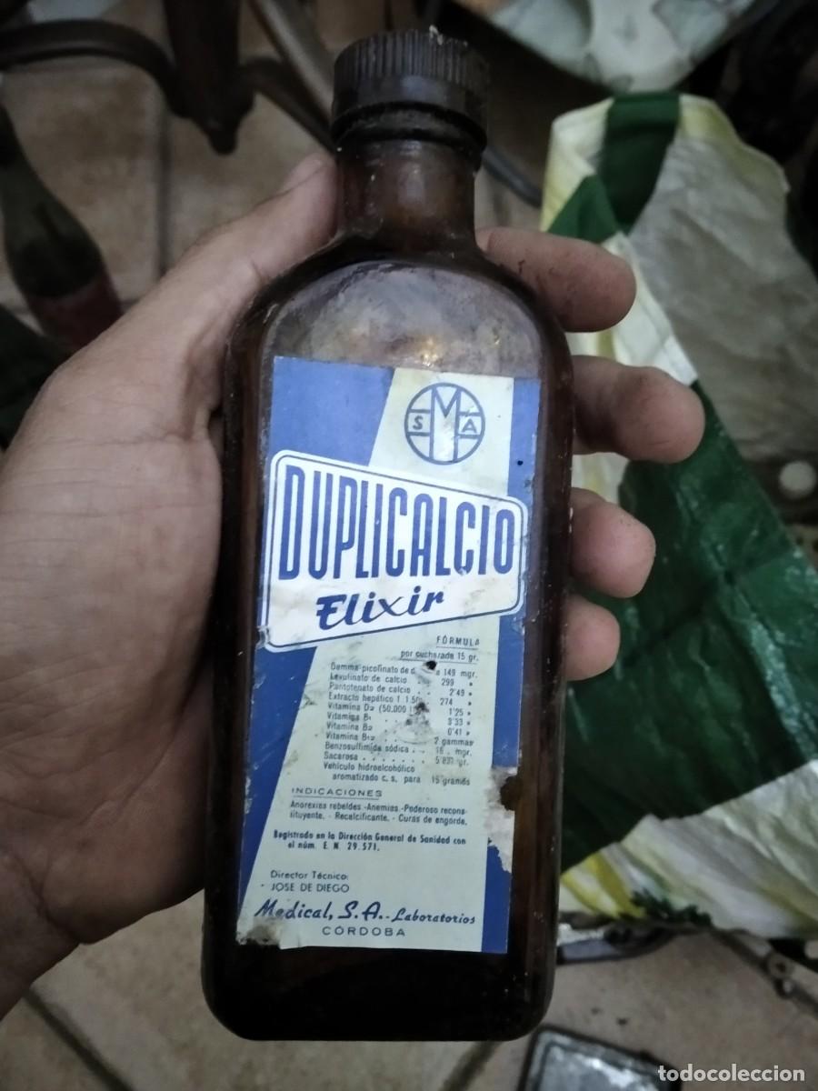 Botellas antiguas: Antiguo envase botella medicamento Duplicalcio elexir - Foto 1