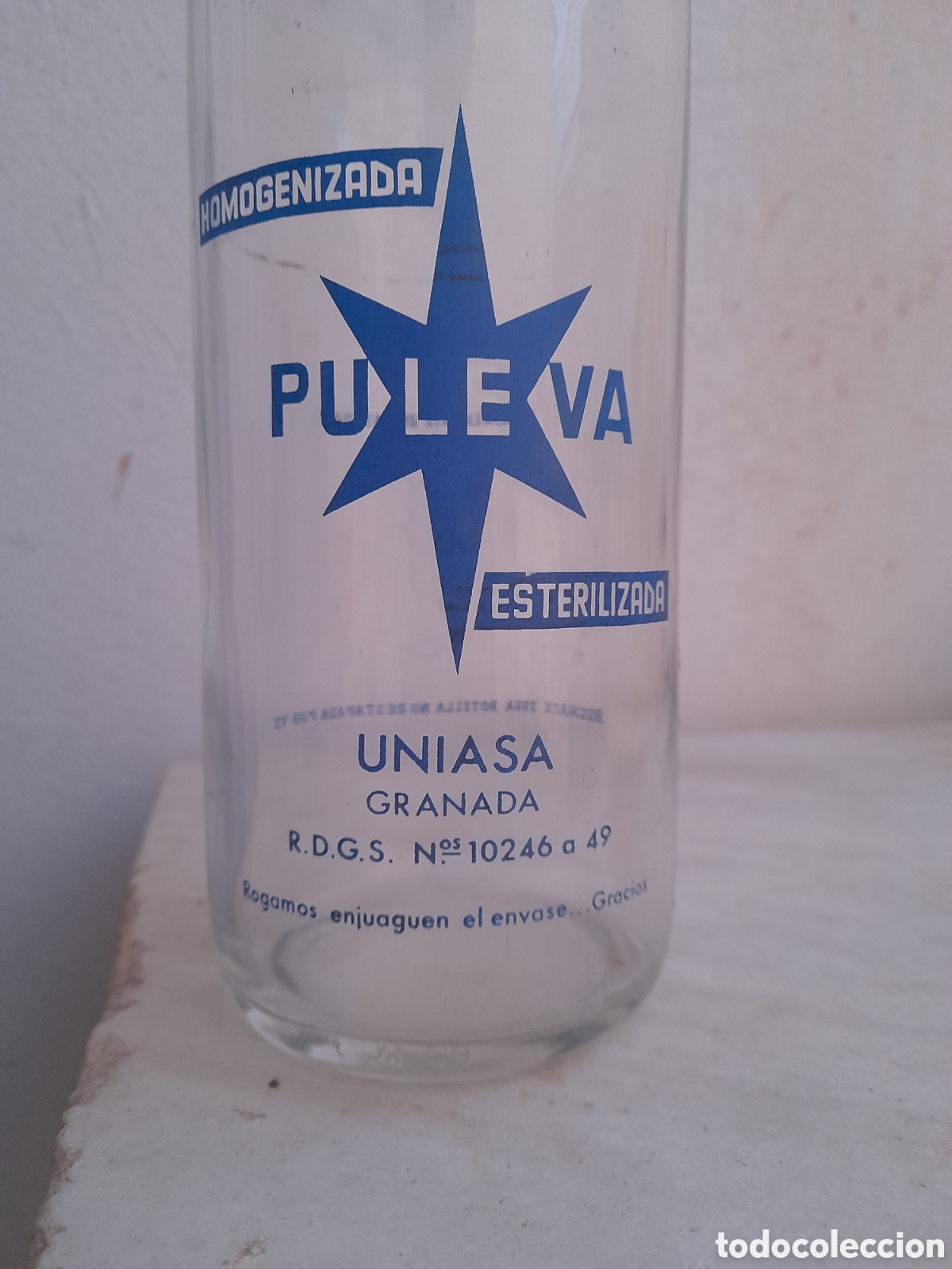 Botellas antiguas: Botella de leche Puleva Uniasa Granada - Foto 2
