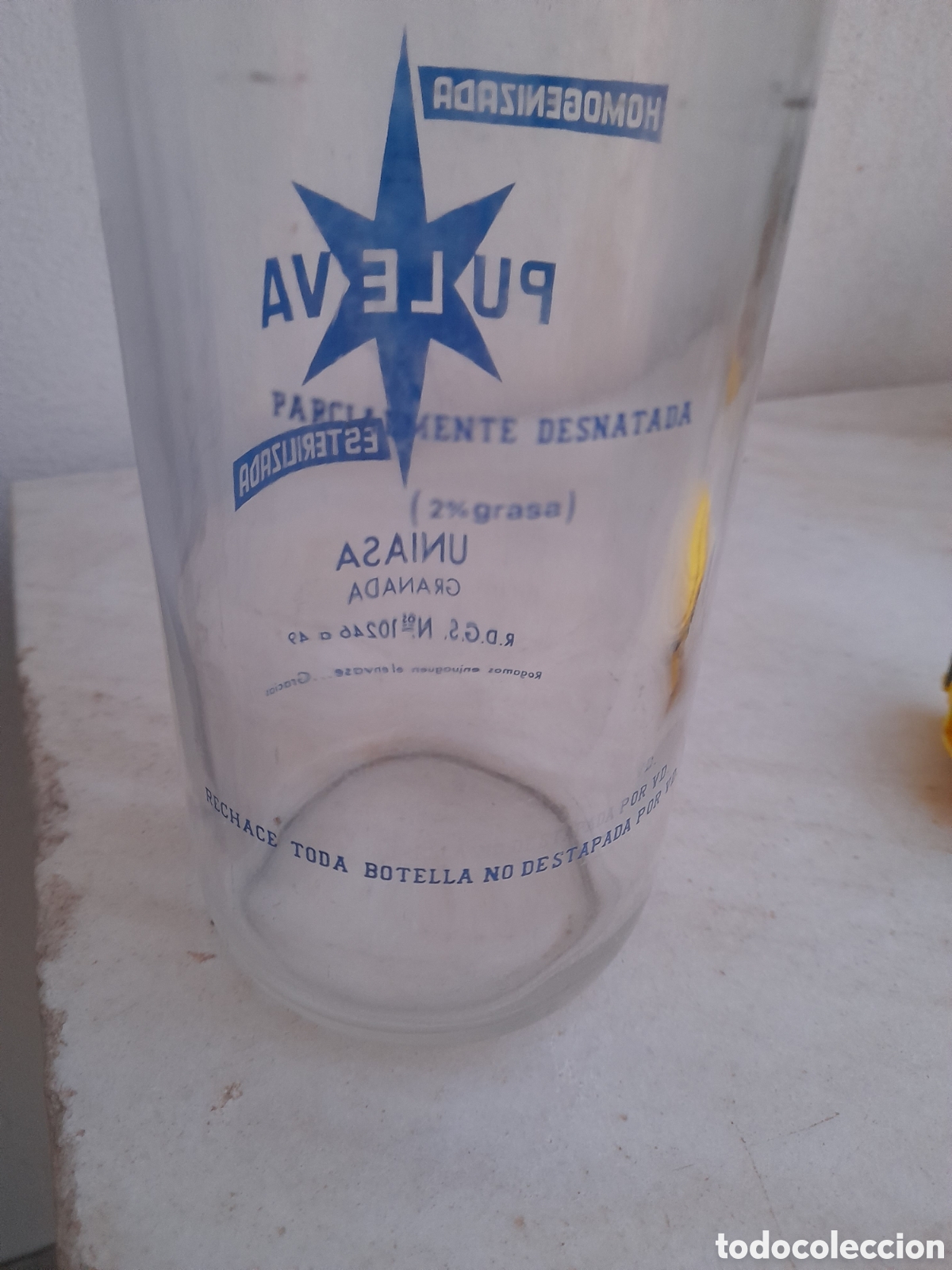 Botellas antiguas: Botella de leche Puleva Uniasa Granada - Foto 3