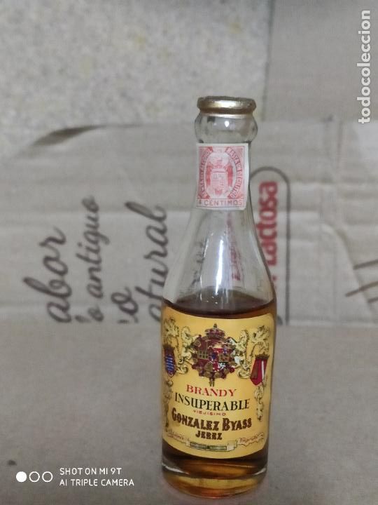 Botellas antiguas: brandy insuperable de gonzalez byass - Foto 1